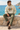 Stone hoodie with olive trousers on a seated male model