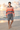 Sunrise beach editorial with grey shorts