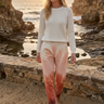 Sunset joggers with cream knit at the coast