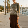 Sweater styled with a chocolate satin skirt