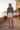 Sweatshirt styled with cream shorts and heels