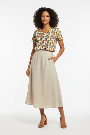 T-shirt with beige midi skirt and strappy heels