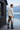 Track pants back view at a lakeside cabin