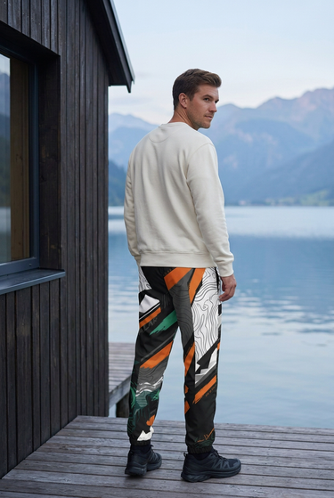 Track pants back view at a lakeside cabin