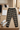 Track pants with white tee in boutique display