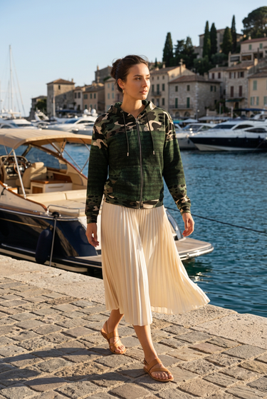 Trailhunter hoodie with a cream midi skirt at a marina
