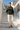 Trailhunter hoodie with ivory linen trousers in a Mediterranean village