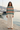 Tropical sweatshirt with cream trousers