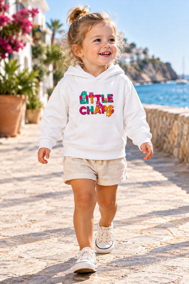 Two-year-old girl in the white LittleChaps hoodie