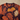 V-neck and upper leaf artwork close-up
