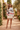 Wave sweater with a ruffled cream mini skirt