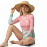 White model with white shorts and sun hat