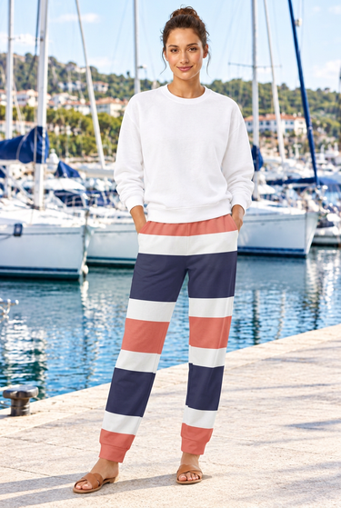 White sweatshirt and striped joggers at the marina