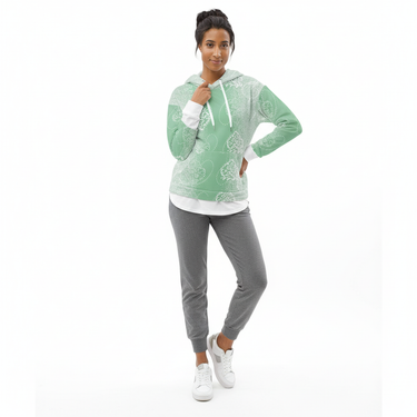 Woman in mint green mandala hoodie layered with gray joggers