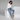 Woman with short hair in Jaguar Blue leopard print joggers with silk blouse