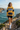 Yellow and navy hoodie styled with cycling shorts on a coastal path